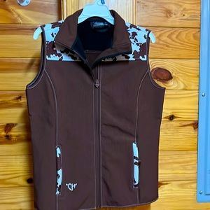 Cowgirl hardware. Cowprint vest